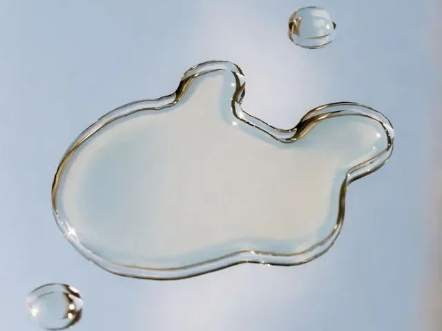 Cool drops of water on a pale blue surface